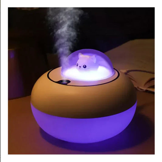 https://cdn.shopify.com/s/files/1/0661/2729/8714/files/difusor-humidificador-gato-nave-luces-esencia2.webp?v=1753666726